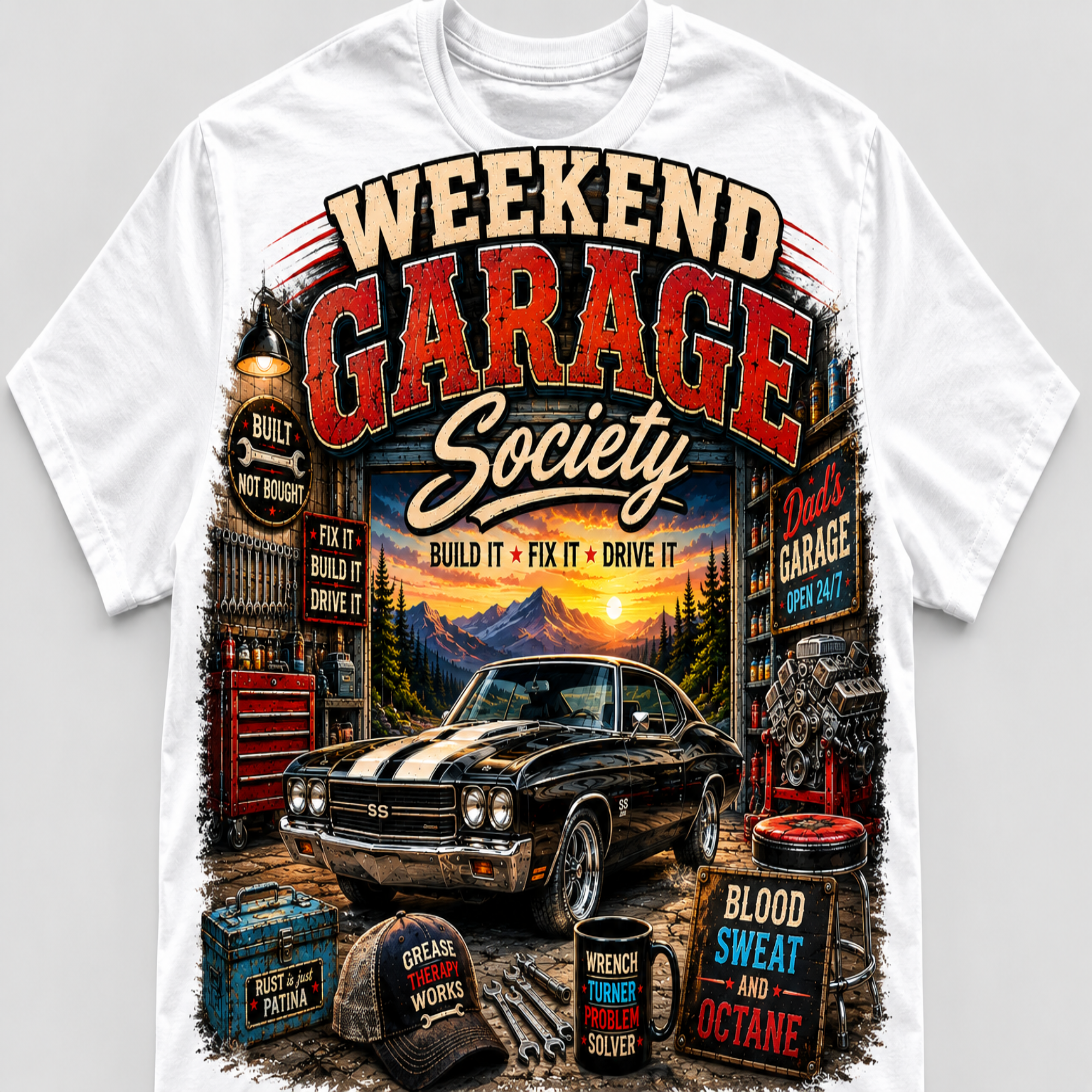 A white short-sleeve crewneck t-shirt featuring a large graphic print on the front. The graphic is themed 'Weekend Garage Society' and displays a black muscle car, a workbench, tools, a hat, a mug, and a stool, all in a rustic garage setting with a sunset sky background.