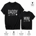 A matching black t-shirt set for adults and children, featuring a large 'DADDY Est. Forever' print on the dad's shirt and a smaller 'MINI Est.