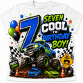 A white short-sleeve t-shirt featuring a vibrant, multi-colored graphic design for a seven-year-old boy's birthday. The design includes a large blue number 7, a blue and green monster truck, balloons, checkered flags, cones, and the text 'SEVEN COOL I'M BIRTHDAY BOY!' and 'PARTY ZONE!'.