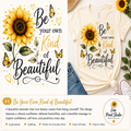 A cream-colored t-shirt featuring a sunflower and butterfly graphic with the text 'Be your own Kind of Beautiful' in black and gold lettering. The shirt is styled in a flat-lay composition with blue jeans, a straw hat, and a sunflower on a white background, with a promotional text banner at the bottom.