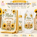 Sunflower personalized baby gift set including a minky blanket, glass baby bottle, and onesie, featuring a teddy bear and sunflower designs with the name Mateo. The set is displayed on a light beige background with promotional text overlays.