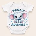 A white short-sleeve baby bodysuit with a cute cartoon elephant graphic and the text 'TOTALLY ADORABLE' printed on the front, shown against a light beige background.