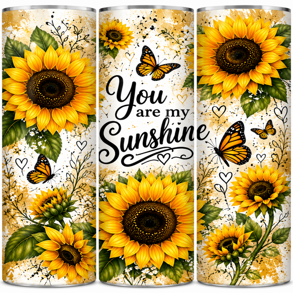 Three tall tumblers with a matching wrap design featuring bright yellow sunflowers, orange butterflies, green leaves, and the phrase 'You are my Sunshine' in black script on a cream background.