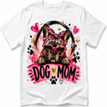 White short-sleeve crewneck t-shirt featuring a colorful graphic of a French Bulldog wearing pink heart-shaped sunglasses and a pink leopard-print headband, with the text 'DOG MOM' in black and gold on a pink watercolor background.