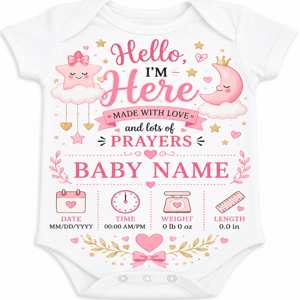 A white short-sleeve baby bodysuit with a pink and gold 'Hello, I'm Here Made with Love and lots of PRAYERS BABY NAME' graphic on the front, featuring cute cartoon stars, a crescent moon, and baby milestone icons at the bottom.
