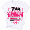 A white short-sleeve crewneck t-shirt with a graphic print that reads 'TEAM GRANDPA BABY LOADING.