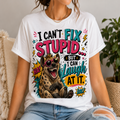 A woman wearing a white graphic t-shirt with a colorful print of a hyena wearing sunglasses and the text 'I CAN'T FIX STUPID.