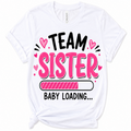 A white short-sleeve crewneck t-shirt with a graphic print that reads 'TEAM SISTER BABY LOADING.