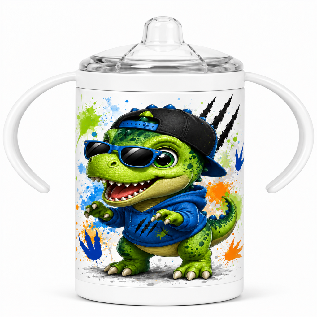 A white baby tumbler with side handles and a clear lid, featuring a colorful cartoon dinosaur wearing a black cap, blue hoodie, and sunglasses on the front.