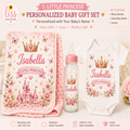 Personalized baby gift set featuring a pink floral minky blanket, a white baby bodysuit, and a glass baby bottle, all decorated with a pink crown, castle, and the name 'Isabella'.