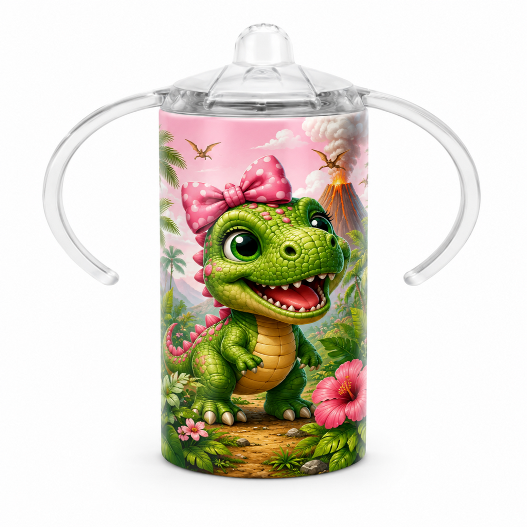 A clear plastic baby tumbler with integrated side handles and a clear spout lid, featuring a colorful printed design of a green cartoon dinosaur wearing a pink bow in a jungle scene.