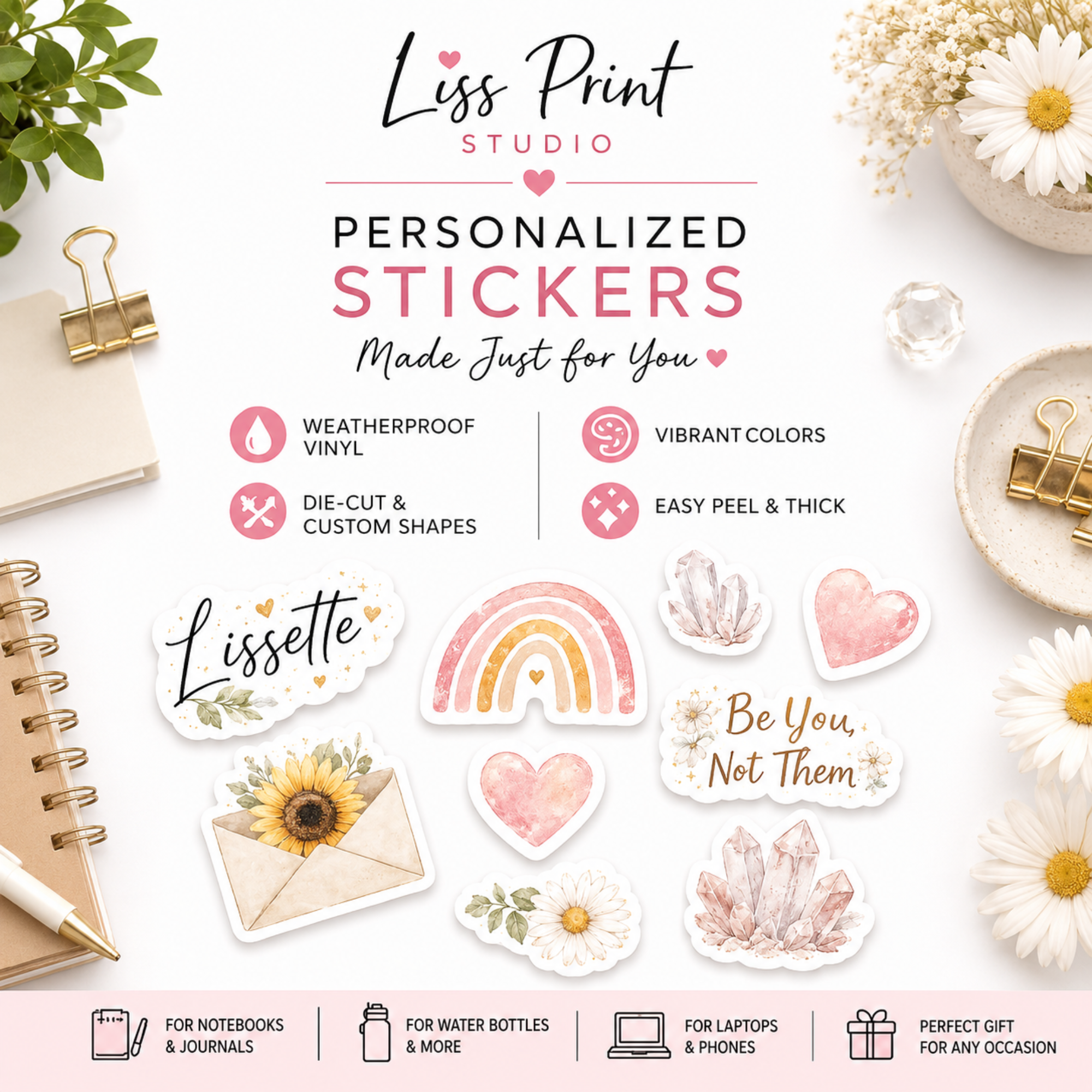 A styled flat-lay of personalized vinyl stickers from Liss Print Studio, featuring watercolor designs like a rainbow, pink hearts, crystals, a sunflower, and text stickers such as 'Lisette' and 'Be You, Not Them' on a white background with decorative stationery props.