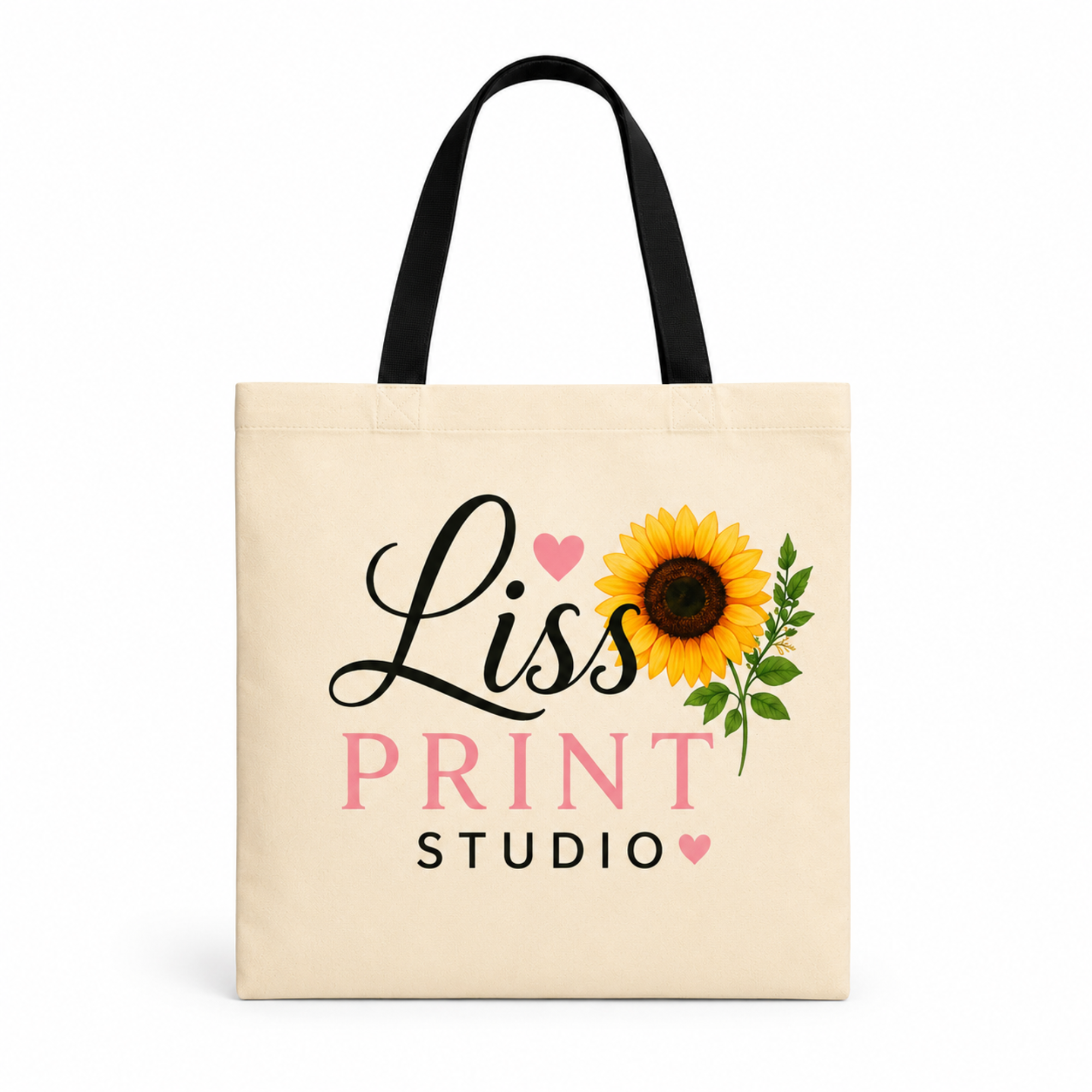 A cream-colored canvas tote bag with black handles, featuring a printed design of a yellow sunflower, pink hearts, and the text 'Liss PRINT STUDIO'.